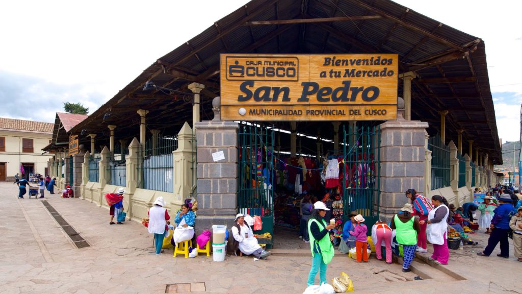 Entrance to San Pedro Market in Cusco, a bustling traditional market filled with local vendors and Andean products - Xplor Machu Picchu