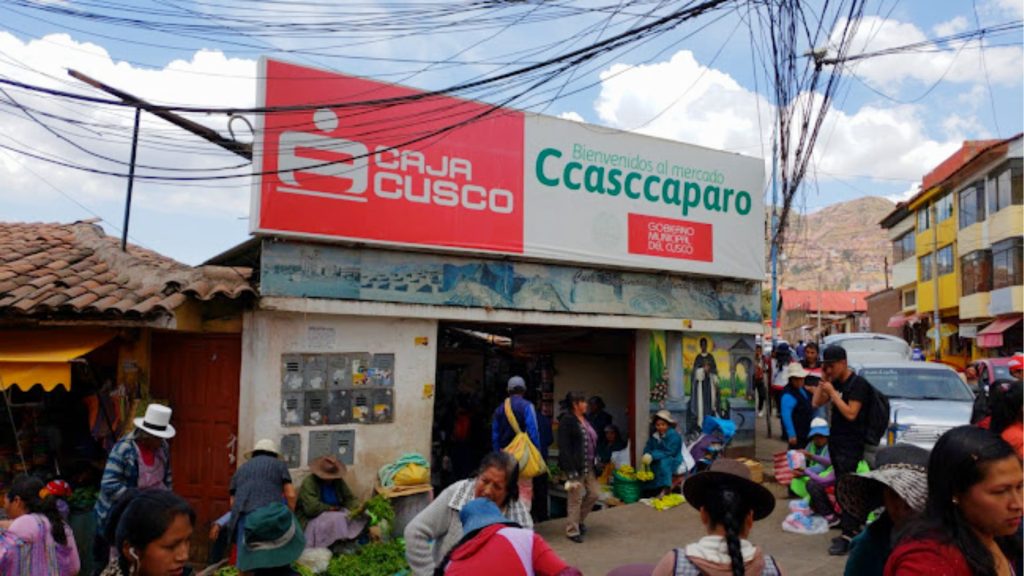 Entrance to Cascaparo Market in Cusco, a traditional market bustling with local vendors and Andean products - Xplor Machu Picchu