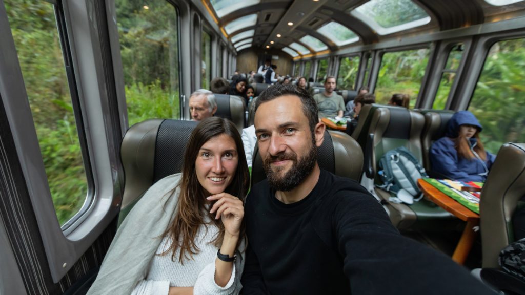 Trains to Machu Picchu with Couple Taking Selfie - Xplor Machu Picchu