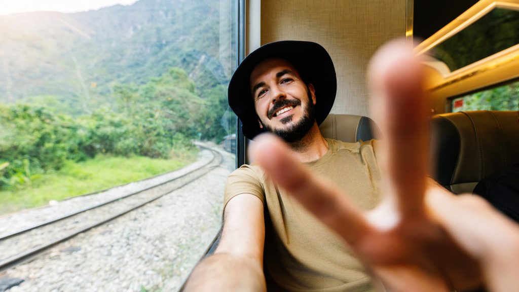 Trains to Machu Picchu with Passenger Taking Selfie - Xplor Machu Picchu